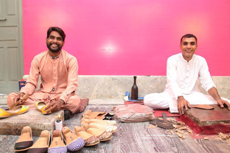 Pakistani artisan men with their shoes