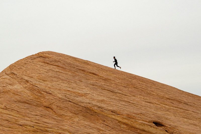 Person running up hill