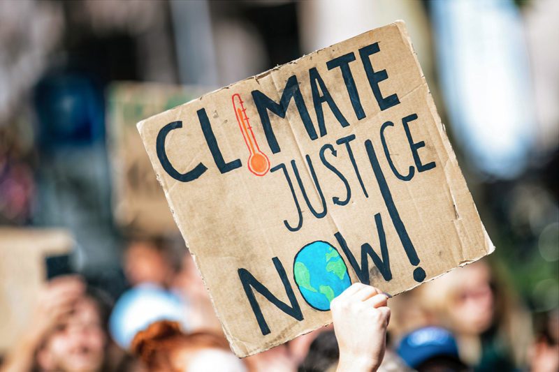 Climate Justice Now! protest sign
