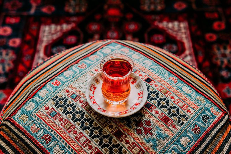 tea on woven rug
