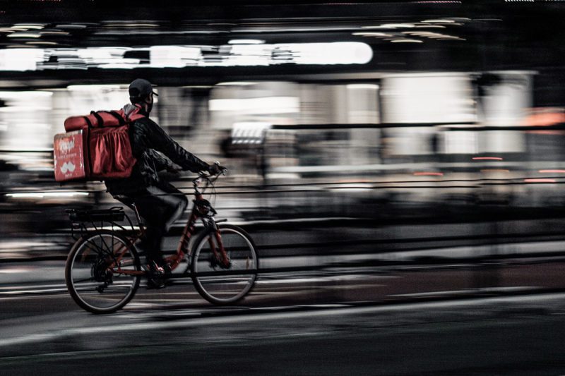 Delivery worker on bicycle