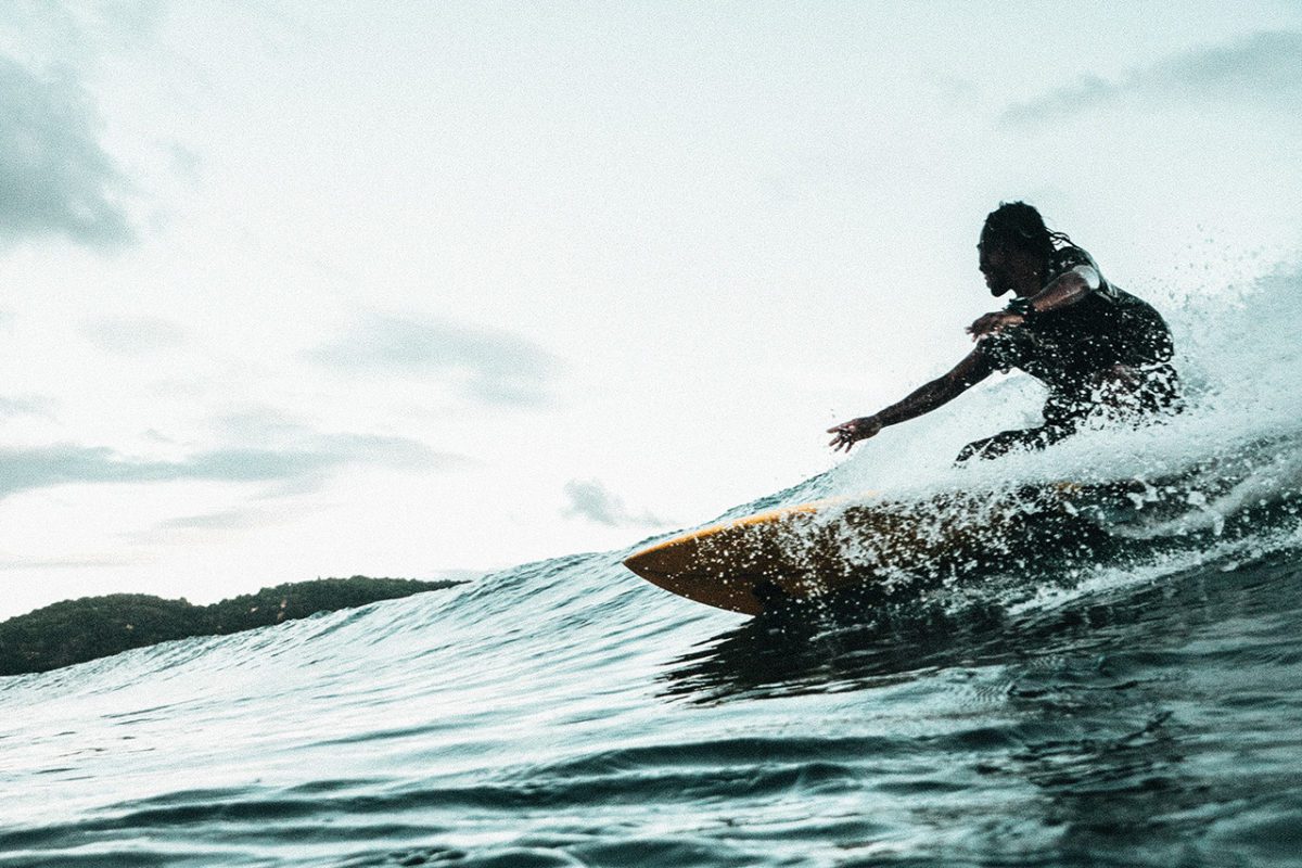Surfer Riding Wave