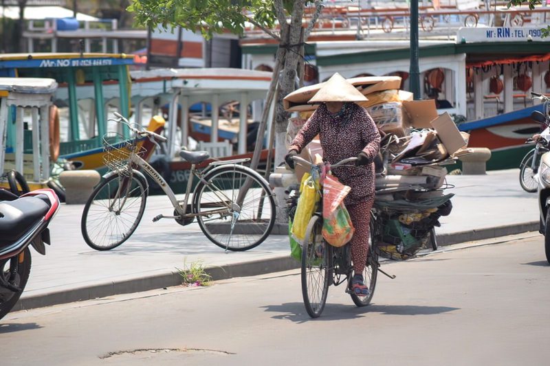 Asian Woman Transporting Plastic Waste
