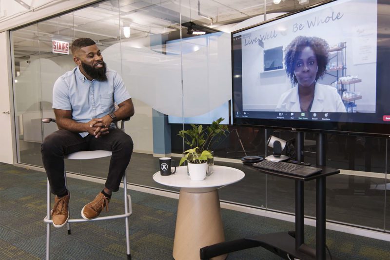 African American man speaking to African American woman remotely