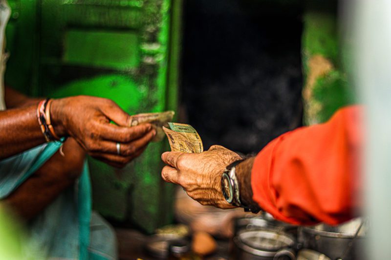 Indian hands exchanging currency