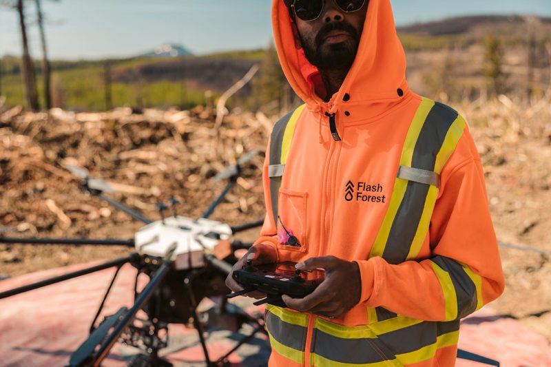 Flash Forest team member with drone