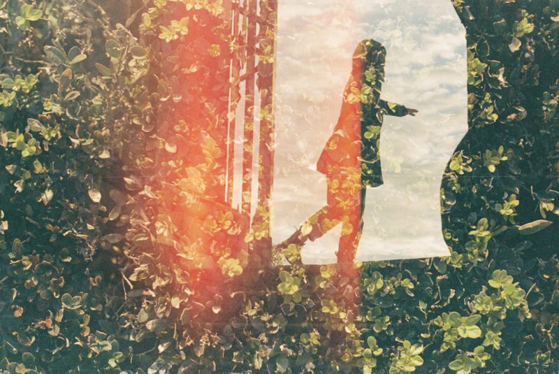Abstract image of person walking in woods