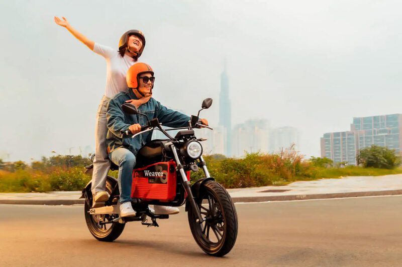 Asian woman and man on e-bike
