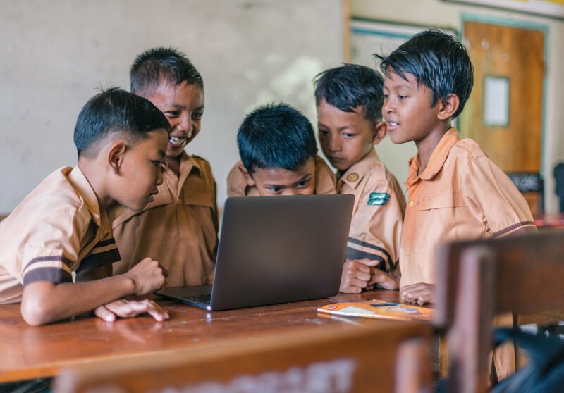 Kids around a computer