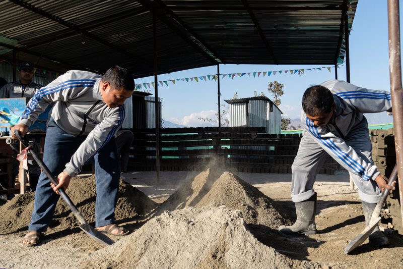 Workers in Nepal making eco bricks