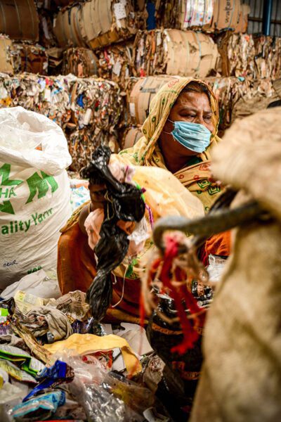 Green collar worker sorting waste