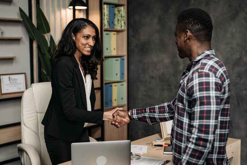 Two professionals greeting each other