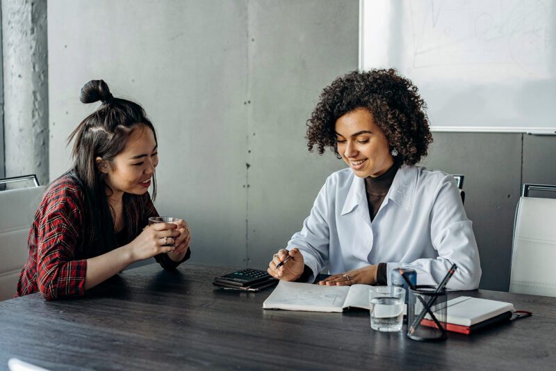Two workers at a conference table