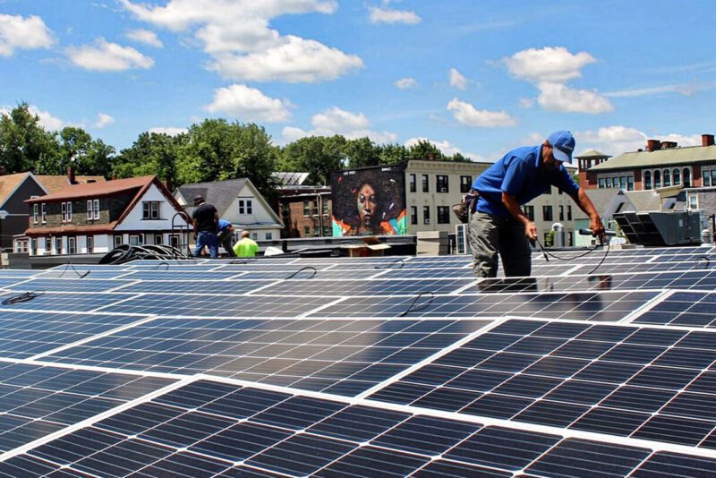 Man on solar panel installation