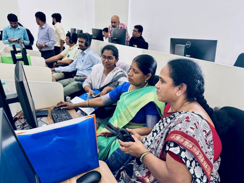 Indian women and men at computer training