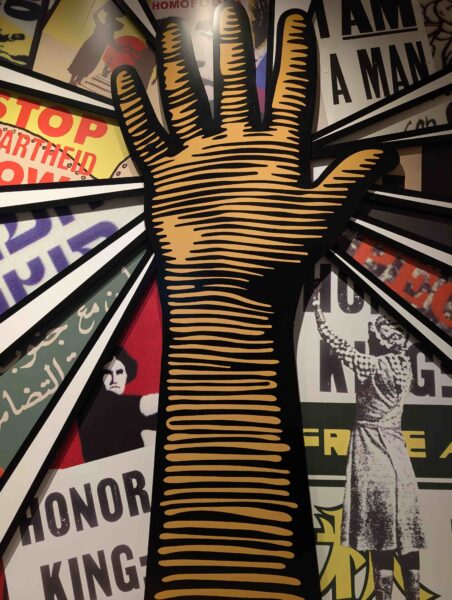 Mural of hand raised in protest