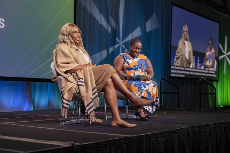Two speakers on stage at conference